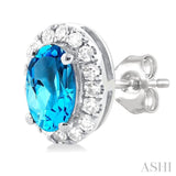 5x3 MM Oval Shape Blue Topaz and 1/8 Ctw Single Cut Diamond Halo Semi-Precious Stud Earrings in 14K White Gold