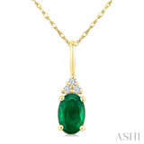 1/50 Ctw Oval Cut 6X4 MM Emerald and Round Cut Diamond Precious Pendant With Chain in 10K Yellow Gold