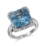 RGR22405 - 14K W/G .21CT SEMI WITH 12X12MM CU BLUE TOPAZ CTR-GH/SI2