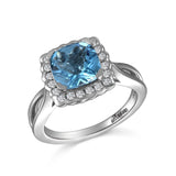 RGR22408-14K W/G 8MM CUSHION CUT BLUE TOPAZ W/ .28 CT -GH/SI2
