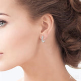 1/6 Ctw Entwined Round Cut Diamond Huggie Petite Earrings in 14K White Gold