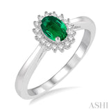 6X4MM Oval Cut Emerald Center and 1/8 Ctw Round Cut Diamond Halo Precious Stone Ring in 10K White Gold